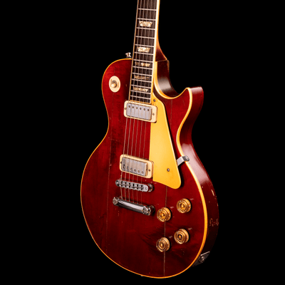 Gibson Les Paul Deluxe Wine Red '79 - $4399990 - Gearhub - First released in 1969, the Deluxe saw the introduction of the mini humbucker™ to the Les Paul lineup. Mini humbuckers retain the hum-free performance of their full-sized cousins but with a somewhat clearer and brighter tonality. The new Deluxe has features that were inspired by those early models from the 1970s, with a non-weight relief mahogany body and bound maple top, a bound mahogany neck with a Rounded C profile, vintage-style Keystone tuners,