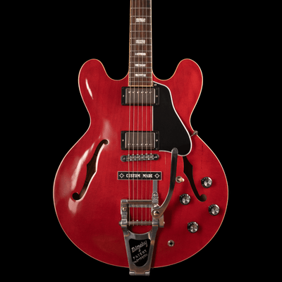 Gibson Memphis Reissue 335 Cherry Bigsby B7 Vibramate 2018 - $4999990 - Gearhub - The Historic Reissue ES-335 is back and better than ever thanks to a year of studying, scanning, and listening to original examples. The expert craftspeople at Gibson Custom Shop have rendered every contour, profile, inlay and color of the priceless vintage models in magnificent detail. The result is a playing and ownership experience that will keep you coming back for more. The 1959 Reissue models feature rounded cutaways, Me