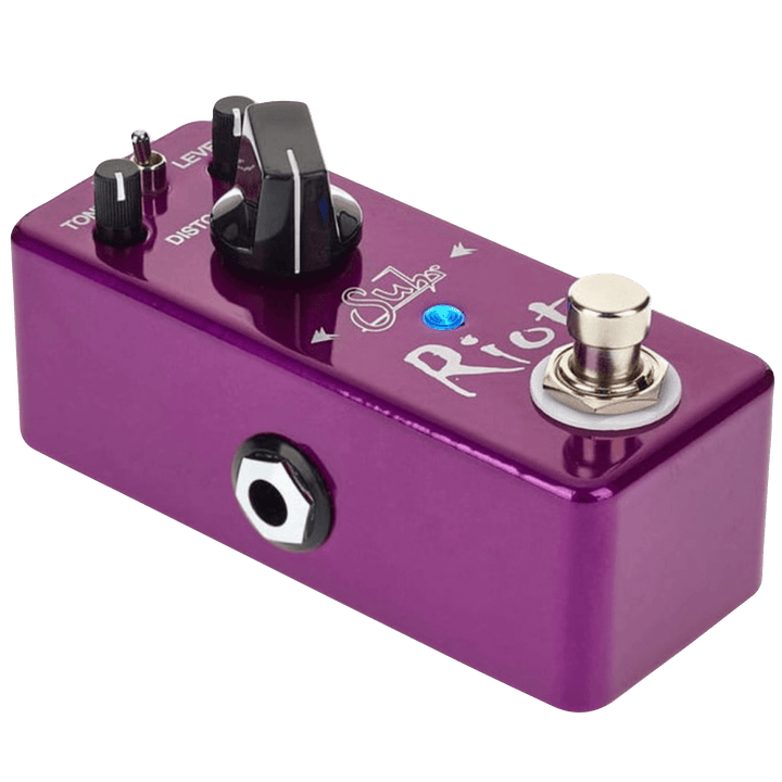 Suhr Riot Mini - Pedal de Guitarra | Hoy en día, las propiedades inmobiliarias de las tablas de pedales son muy valiosas, especialmente cuando se viaja. Y seamos realistas, a veces tener que elegir qué pedales dejar fuera de tu tabla realmente puede limit